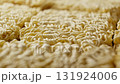 Uncooked instant noodles rotating. Fast food. Production of instant noodles 131924006