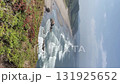 Waves breaking on a long, sandy beach 131925652