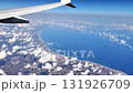 A breathtaking aerial view that beautifully highlights the coastline and vast ocean from the window of an airplane 131926709