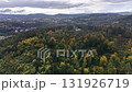 A breathtaking aerial view beautifully showcasing the vibrant colors of autumn across a peaceful forested landscape 131926719