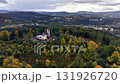 Stunning aerial footage of a vibrant forest, vintage castle, and picturesque landscape that enchants viewers 131926720