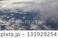 Flying above the clouds airplane window view 131929254
