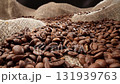 Coffee beans pour into pile. Freshly roasted coffee beans. Slider dolly shot 131939763