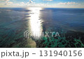 Aerial view of the coral reef sea moving towards the sunrise Aerial view of the coral reef sea moving towards the sunrise 131940156