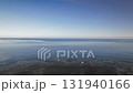 Pan down from the horizon and take an aerial walk over the coral reef sea Pan down from the horizon and take an aerial walk over the coral reef sea 131940166