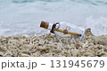Message in the bottle on a sand beach. Shot on super slow motion camera 1000 fps. 131945679