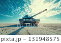A powerful tank positioned in a vast desert landscape under a bright blue sky with scattered clouds. 131948575