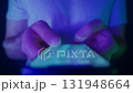 Close-up of hands holding a smartphone. Late night doom scrolling on smartphone screen 131948664
