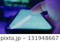 Close-up of hand holds smartphone and scrolling through social media in dark 131948667