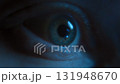 Close up of human eye looking at glowing display with screen reflection 131948670