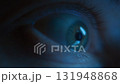 A macro shot of wide-open human eye madly staring at a glowing phone screen at night 131948868