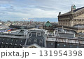 A stunning, high-angle panoramic view of the Parisian skyline on a bright, cloudy day, 131954398