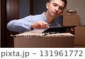 Man checking inventory on tablet during moving or delivery 131961772