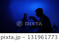 Man working late night on computer drinking coffee 131961773