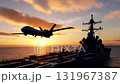 Advanced twin-boom surveillance drone flies past a naval vessel's superstructure on its flight deck during a golden hour ocean sunset 131967387