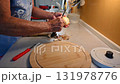 Woman cutting and preparing vegetables at home in the kitchen. Concept for cooking and food preparation. 131978776