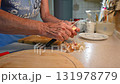 Woman cutting and preparing vegetables at home in the kitchen. Concept for cooking and food preparation. 131978779