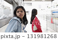 Teenage Friends Waiting at Transit Station 131981268