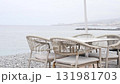An Empty Coastal Dining Area Featuring a Scenic View of the Ocean 131981703