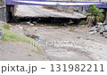 Neglected and Abandoned Underpass Filled with Litter and a Dry Streambed 131982211