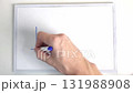 person's hand writes on a white board the inscription I hope  131988908