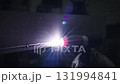 Welder using tig welding torch on metal 131994841