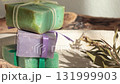 Cubes of natural soap against backdrop of natural elements. Handicrafts and hobbies. Cosmetics and beauty. Eco-friendly products. Background, composition for design. 131999903