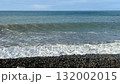 Ocean waves crashing on pebbled shore, clear blue sky, perfect for serene background scene video 132002015