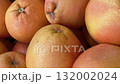 Close-up of fresh grapefruits showcasing textured peel, suitable as a natural food background video 132002024