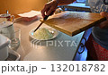 Woman cutting and preparing vegetables at home in the kitchen. Concept for cooking and food preparation. 132018782