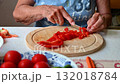Woman cutting and preparing vegetables at home in the kitchen. Concept for cooking and food preparation. 132018784