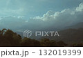 Landscape of greenery rainforest and hills on foggy day. Sky and mist over the mountains. 132019399