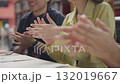 Teamwork and businesspeople in an office setting applaud for achievement or success. Collaboration, and a group of financial advisors applaud for goals, unity, or harmony. 132019667