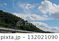 A highway passing through the foot of the mountain and the blue autumn sky 132021090