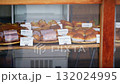 A storefront lined with delicious-looking bread 132024995