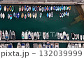 Aerial view of colorful boats and yachts moored at marina pier over turquoise water. Top view of harbor with docked vessels and calm sea surface. 132039999