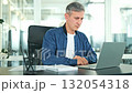 Calm Professional Man Closes Laptop After Focused Office Work 132054318