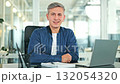 Cheerful Businessman Smiling in Modern Office 132054320