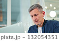 Pensive Businessman Reflecting While Working on Laptop 132054351