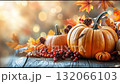 Beautiful autumn display with pumpkins, colorful leaves, and decorative elements for seasonal celebration 132066103