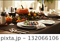 Elegant table setting for autumn dinner gathering with seasonal decor and fresh food 132066106