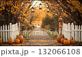 Autumn path decorated with pumpkins and lanterns in a peaceful setting 132066108