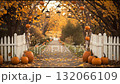 Autumn pathway adorned with pumpkins and lanterns offers a cozy seasonal atmosphere in a vibrant park 132066109