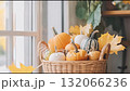 Harvest season brings colorful pumpkins and autumn leaves in a cozy indoor setting 132066236
