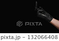 A Hand in a White Glove Hits a Hand in a Black Glove to Stop It from Showing the Middle Finger. Concept of Doctors' Disagreement. 132066408