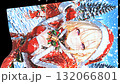 Christmas image: A beautiful girl in a Santa costume printed on a flag. Snow falling and swaying in the wind. Vertical material. Loopable. 132066801