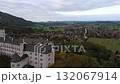 Overcast drone flight around Schloss Hohenaschau, Aschau im Chiemgau, Bavaria, surrounded by misty trees and steep slopes. Nebel, Kampenwand und Chiemgauer Alpen im Hintergrund 132067914