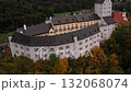 Drone view of Schloss Hohenaschau on a foggy morning in Bavaria, Germany, Kampenwand ridge hidden in clouds above forest. Schloss im Priental, Nebelwald, Aschau im Chiemgau 132068074