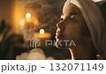 Spa facial treatment with steam and aromatherapy in a soft glowing setting, ideal for beauty, wellness, and skincare visuals in slow motion format	 132071149