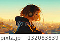 Woman looking at the city while listening to music 132083839